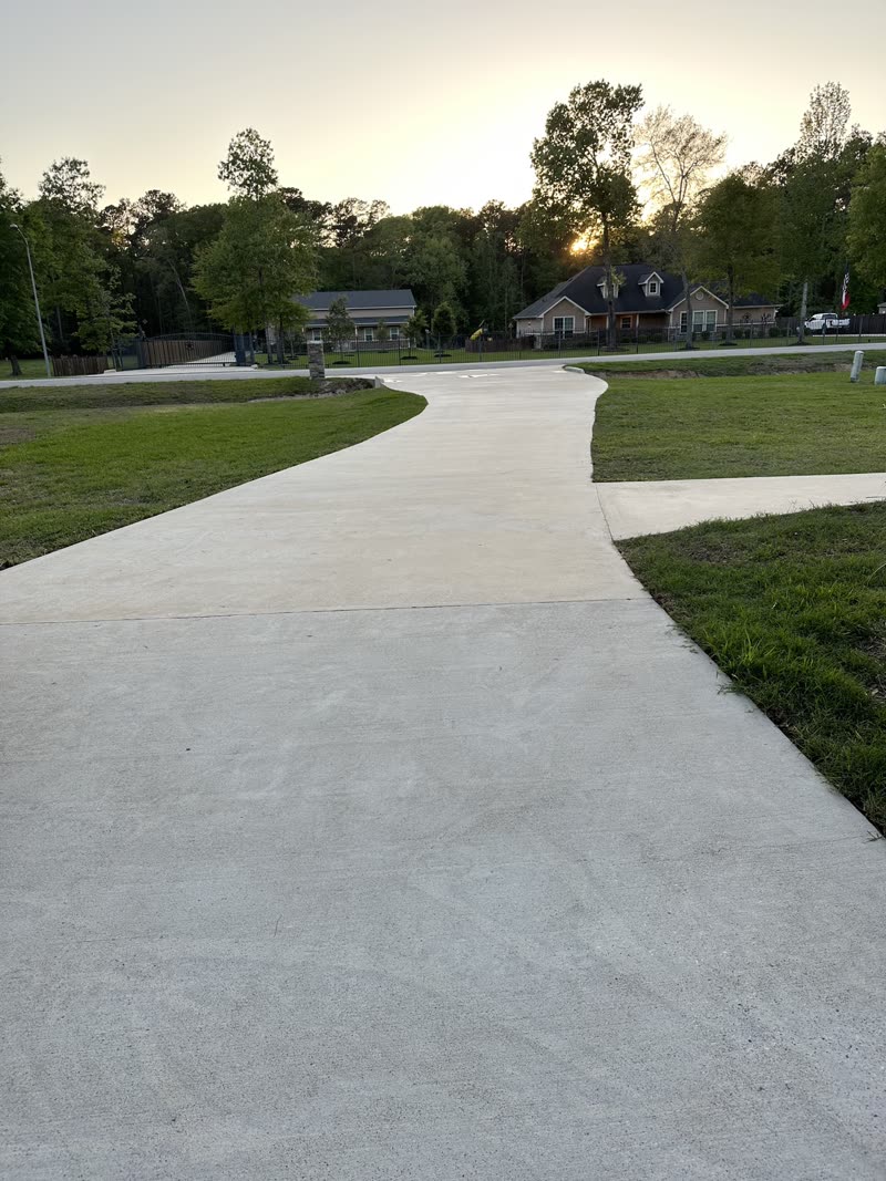 Freshly cleaned curved concrete driveway